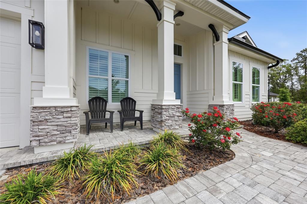 10776 Southwest 36th Place Gainesville, FL 32608 - Photo 3 of 44 a view of house with patio outdoor seating and plants