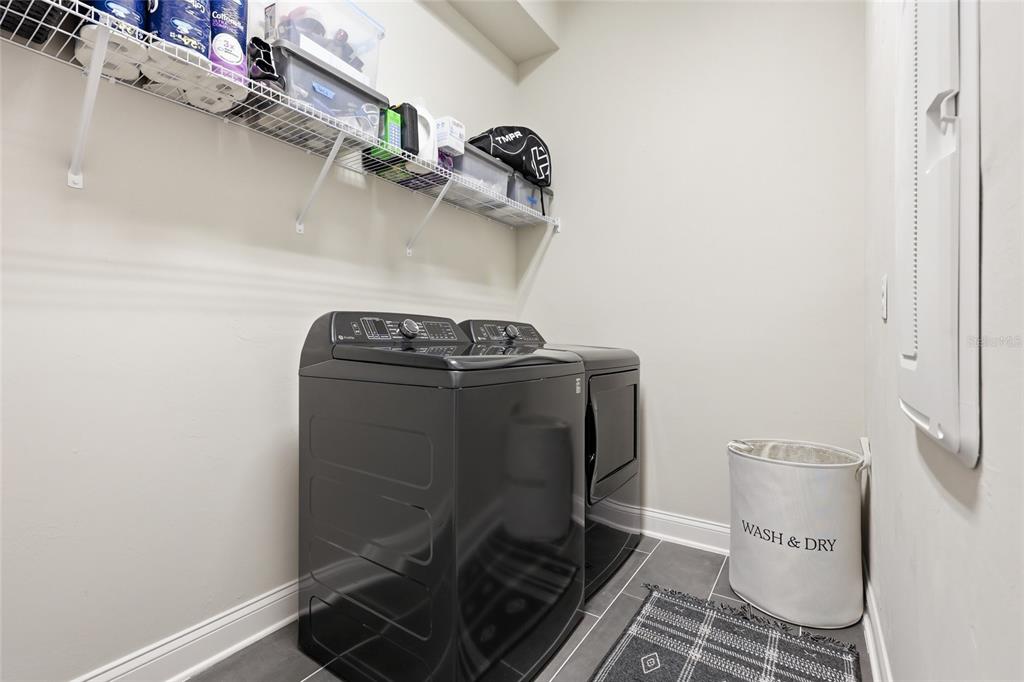 10776 Southwest 36th Place Gainesville, FL 32608 - Photo 35 of 44 a close view of a utility room with dryer and washer