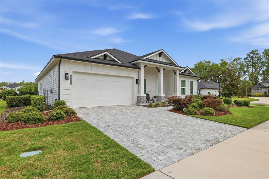 10776 Southwest 36th Place Gainesville, FL 32608 - Photo 42 of 44 a front view of a house with a yard and garage