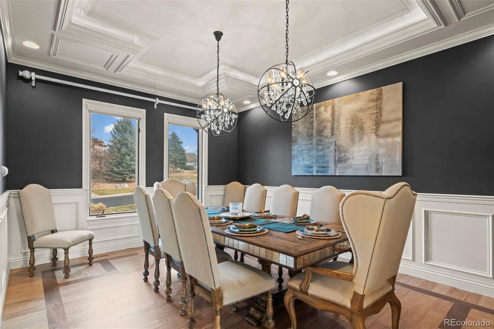 1012 Michener Way Highlands Ranch, CO 80126 - Photo 14 of 50 a dining room with furniture a chandelier and wooden floor