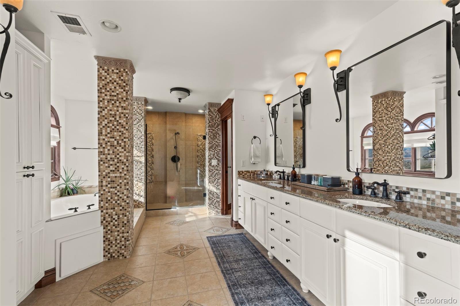 1012 Michener Way Highlands Ranch, CO 80126 - Photo 21 of 50 a bathroom with a double vanity sink and a mirror