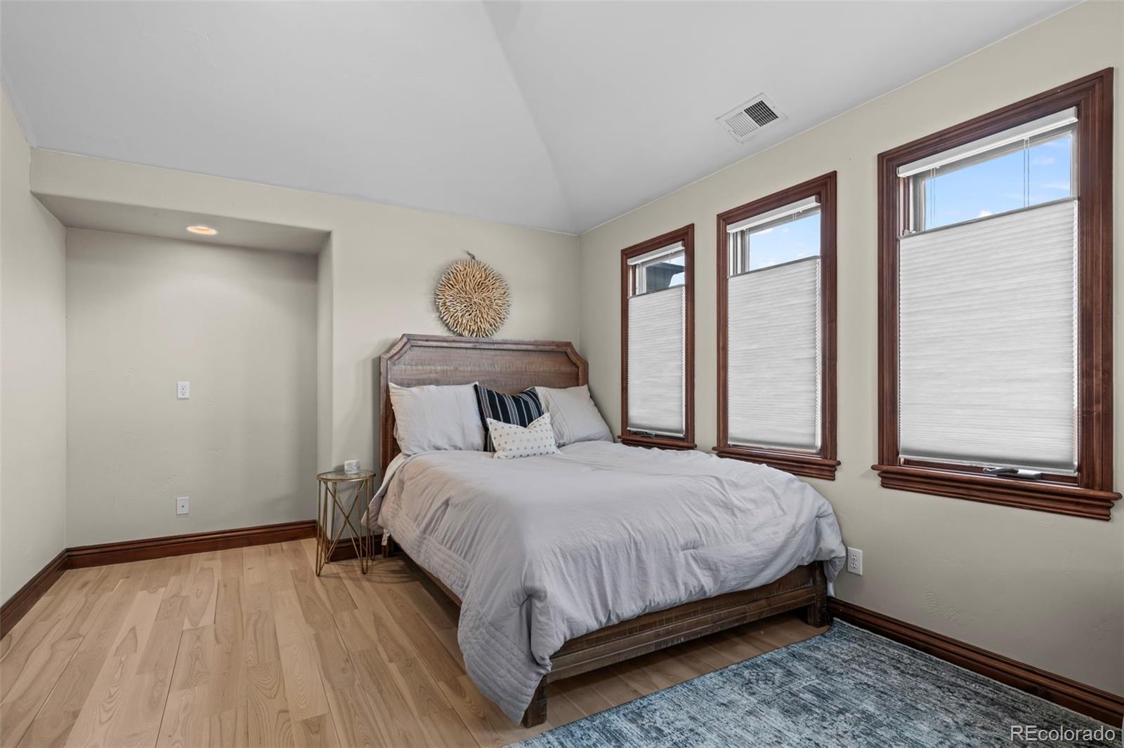 1012 Michener Way Highlands Ranch, CO 80126 - Photo 24 of 50 a bedroom with a bed and window