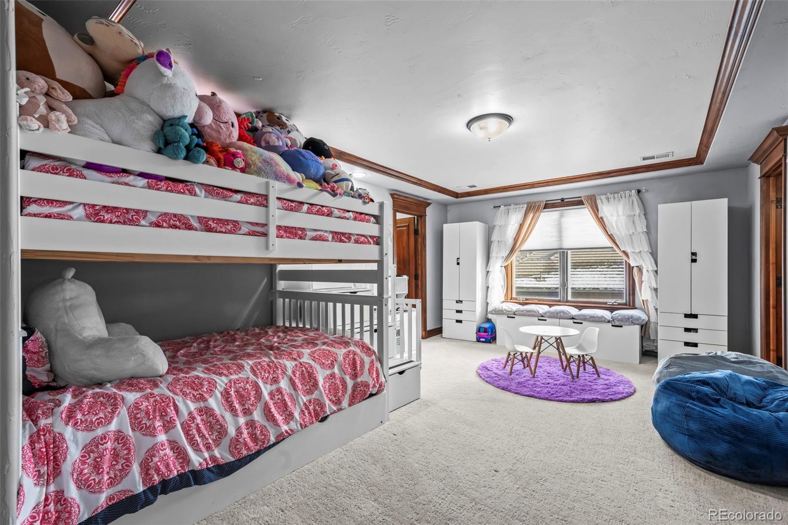 1012 Michener Way Highlands Ranch, CO 80126 - Photo 29 of 50 a bedroom with bed and a window