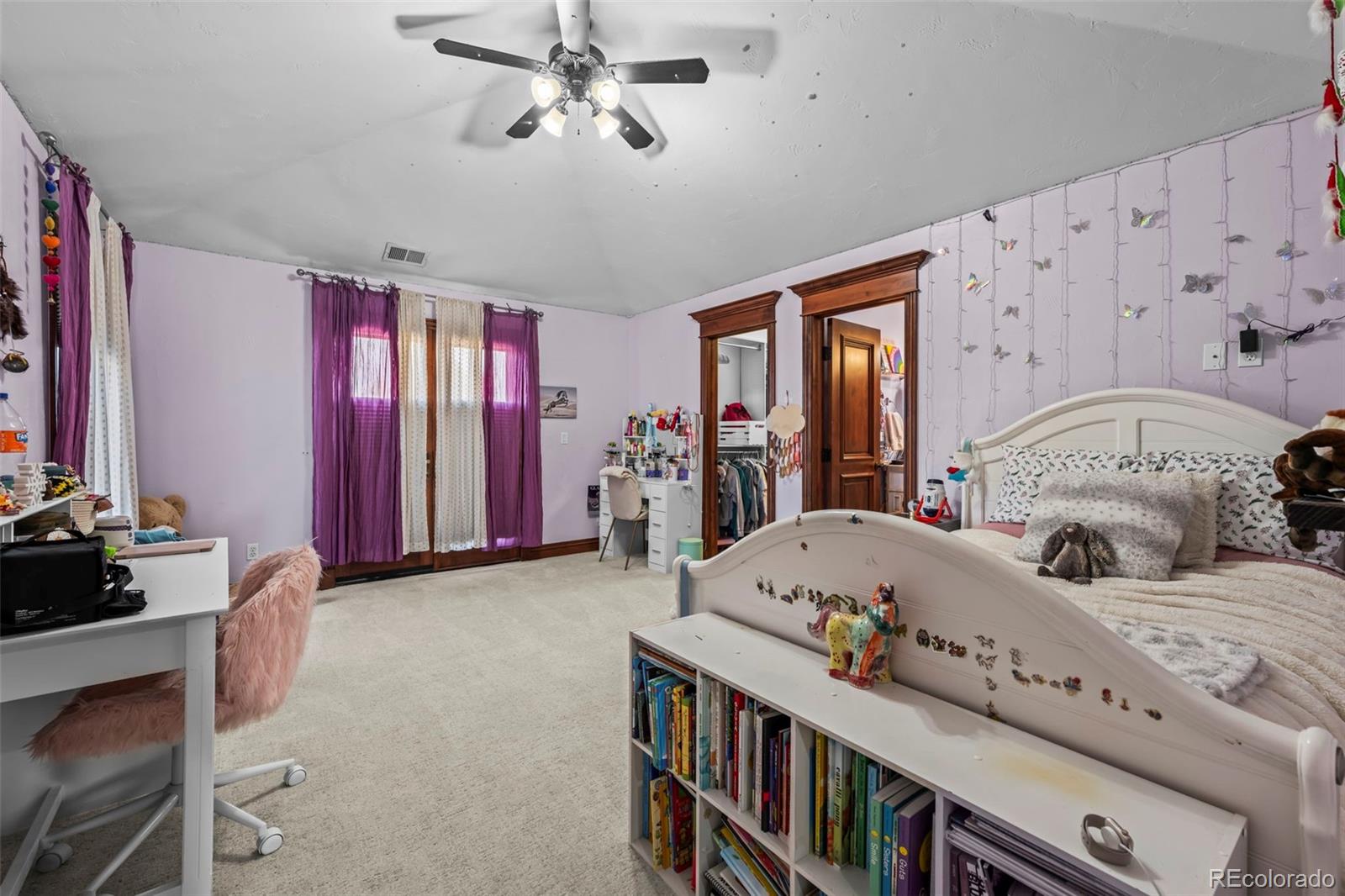 1012 Michener Way Highlands Ranch, CO 80126 - Photo 31 of 50 a bedroom with furniture and a large window