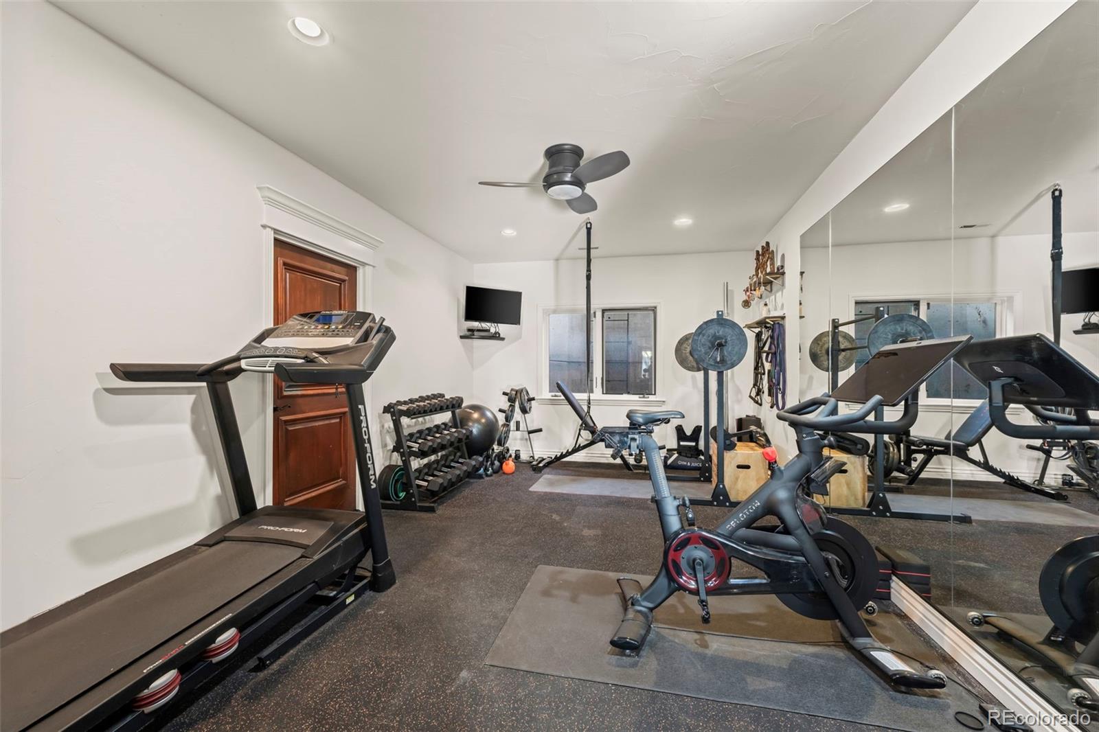 1012 Michener Way Highlands Ranch, CO 80126 - Photo 38 of 50 a view of a room with gym equipment