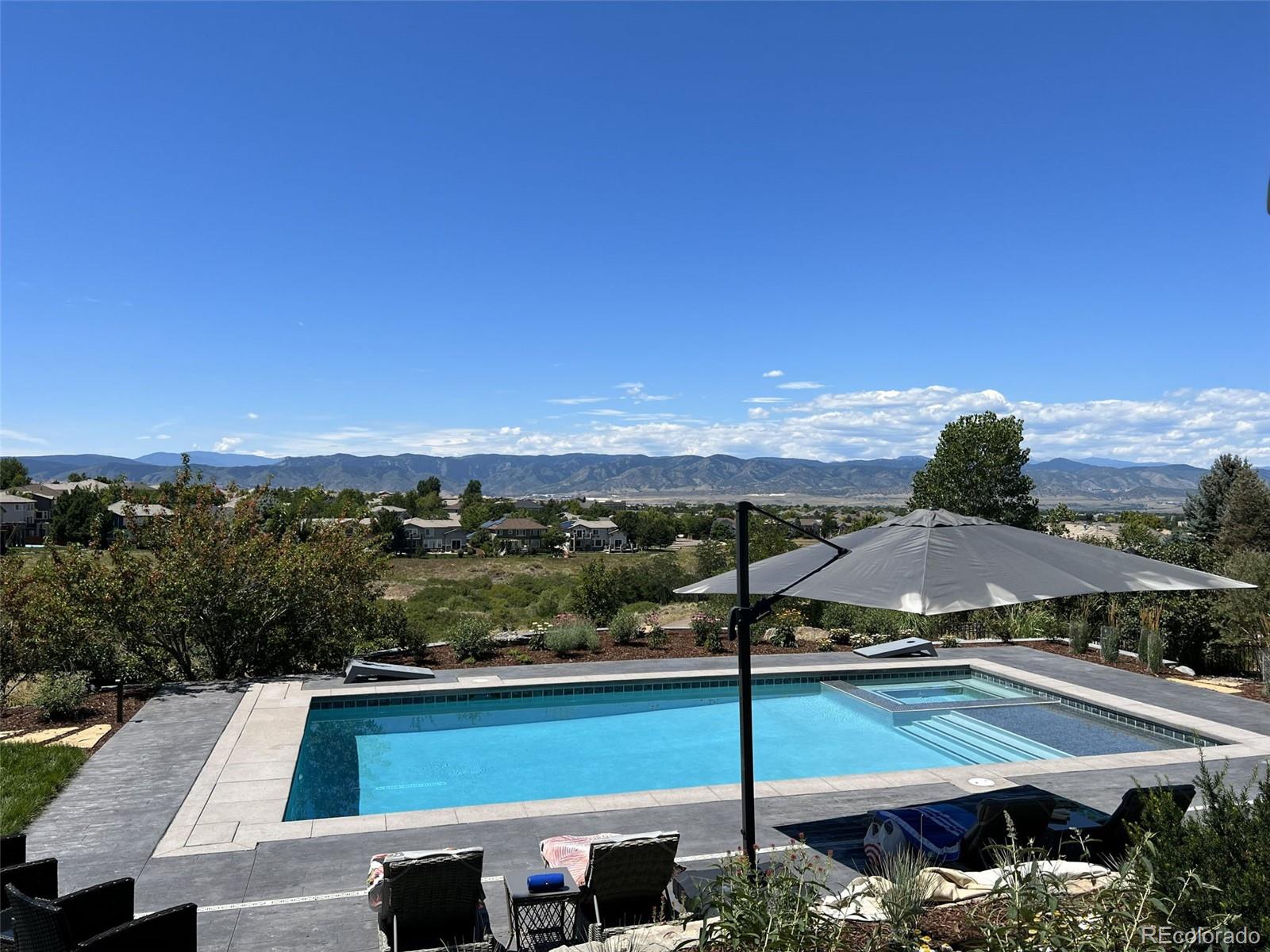 1012 Michener Way Highlands Ranch, CO 80126 - Photo 4 of 50 a view of a balcony with an outdoor space and seating
