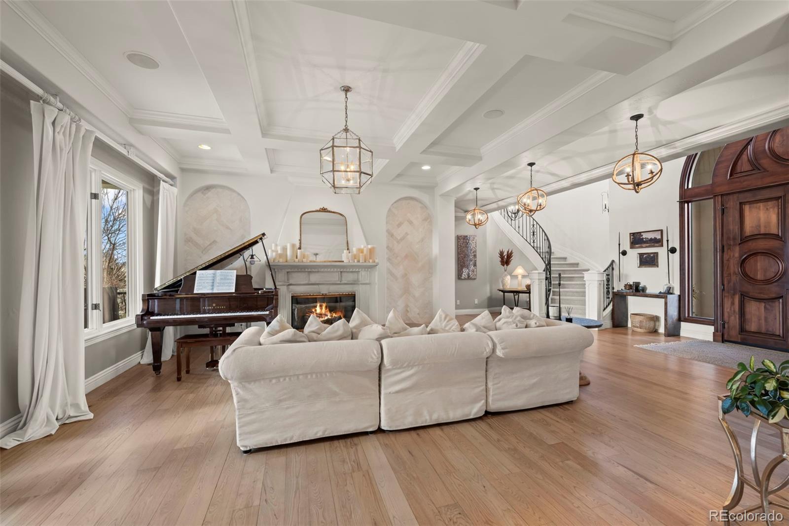 1012 Michener Way Highlands Ranch, CO 80126 - Photo 7 of 50 a living room with furniture and a wooden floor