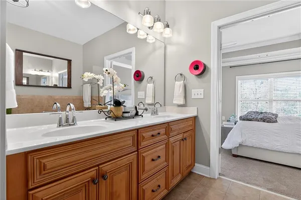 a bathroom with a sink vanity and a mirror