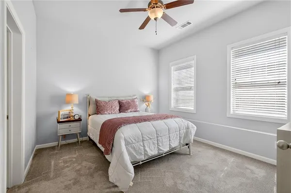 a bedroom with a bed and window