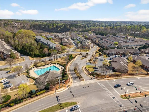 an aerial view of residential houses with outdoor space