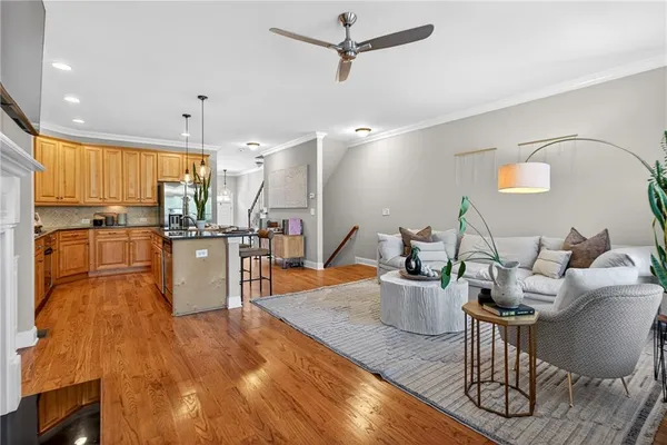 a kitchen with a sink appliances and cabinets
