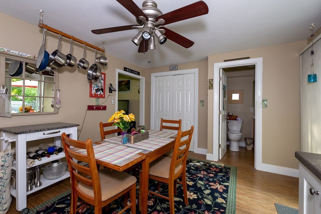 130 Old Ferry Road, Unit B Haverhill, MA 01830 - Photo 12 of 30 a view of a dining room with furniture and wooden floor