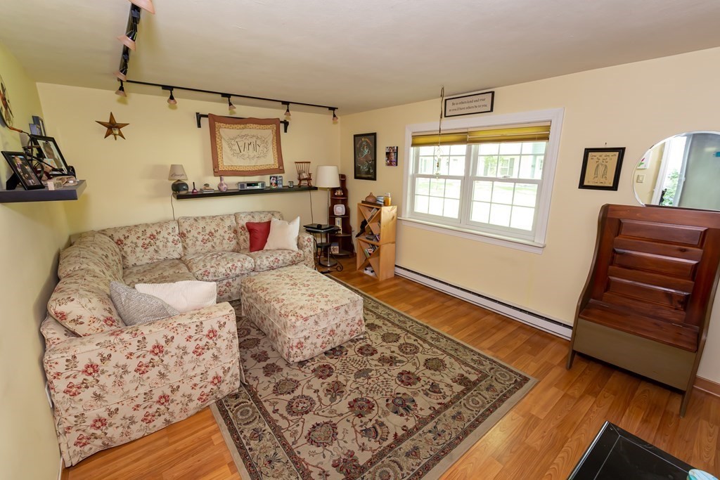 130 Old Ferry Road, Unit B Haverhill, MA 01830 - Photo 17 of 30 a bedroom with furniture and wooden floor