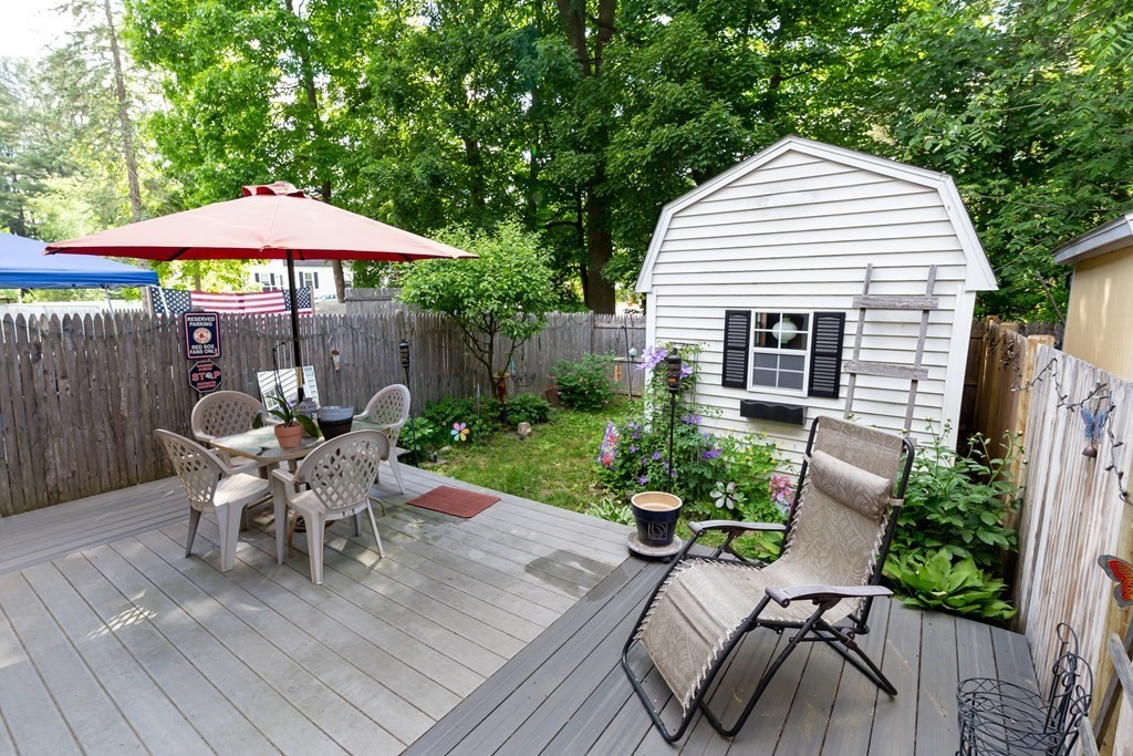 130 Old Ferry Road, Unit B Haverhill, MA 01830 - Photo 6 of 30 a view of a house with backyard sitting area and furniture