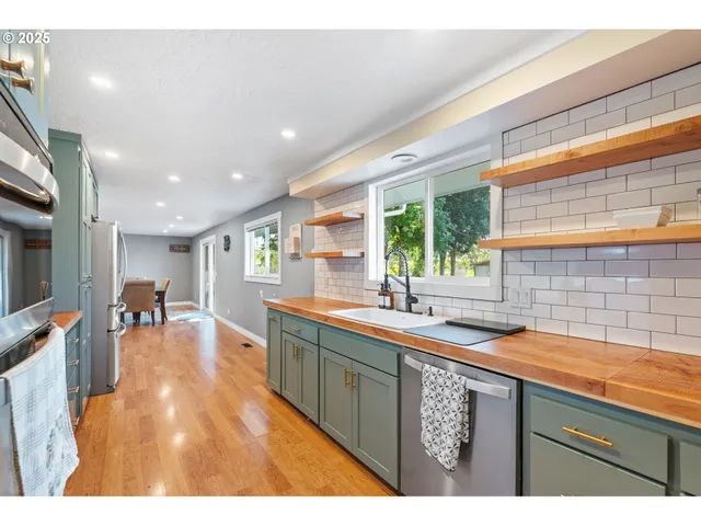a kitchen with a sink and wooden cabinets