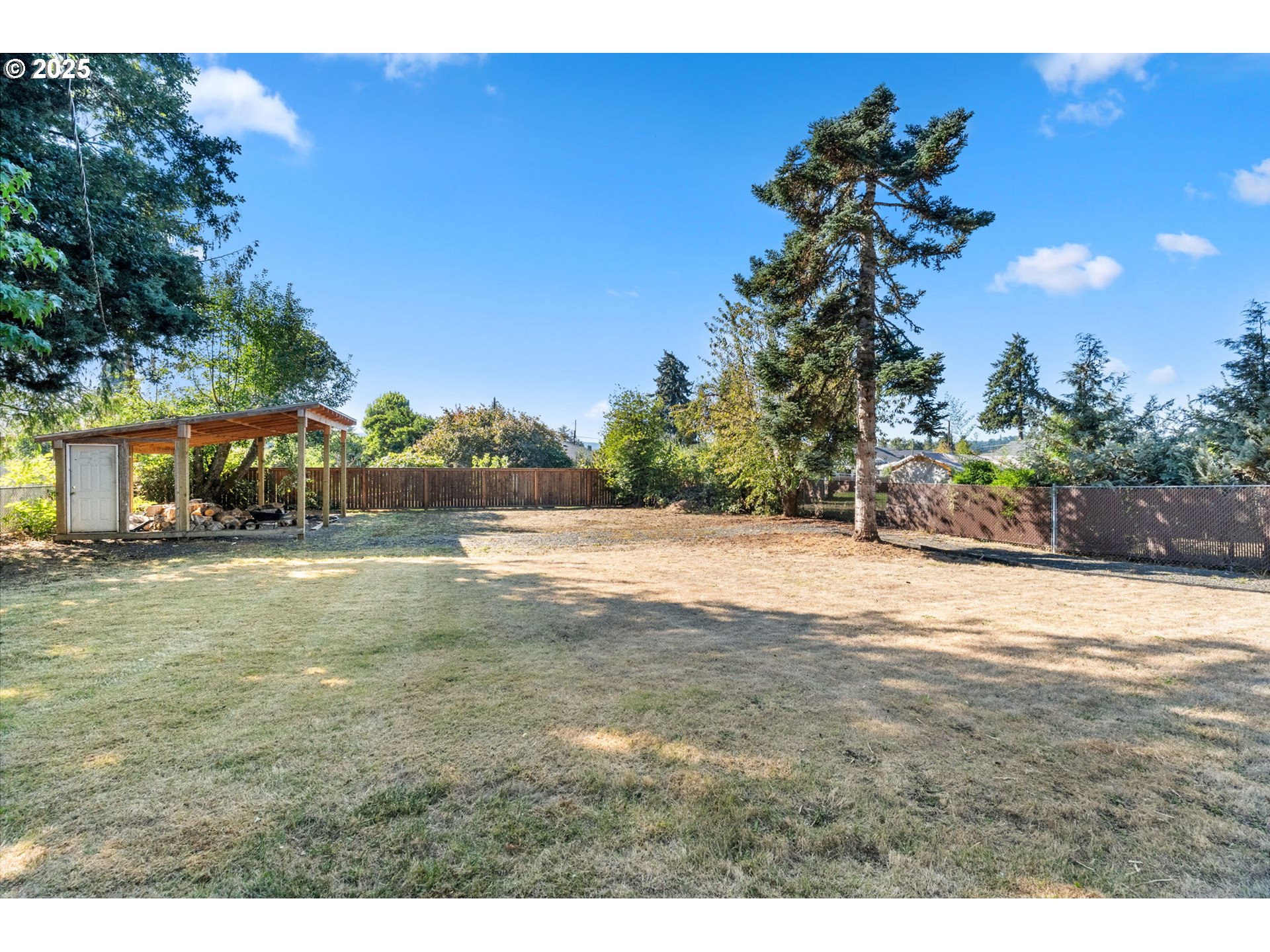 1035 South 11th Street Cottage Grove, OR 97424 - Photo 24 of 30 a view of a yard with a house