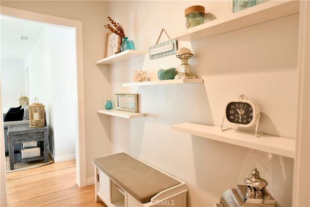 a view of kitchen and utility room with wooden floor