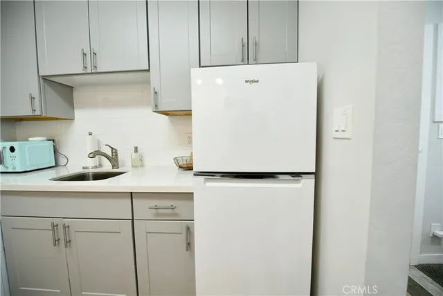 a kitchen with appliances and cabinets
