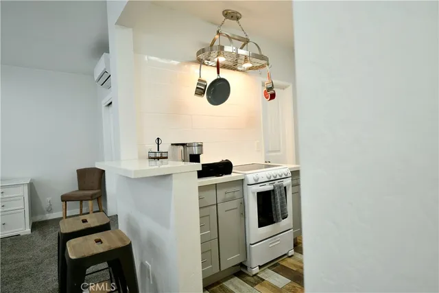 a kitchen with stainless steel appliances granite countertop a sink and stove top oven