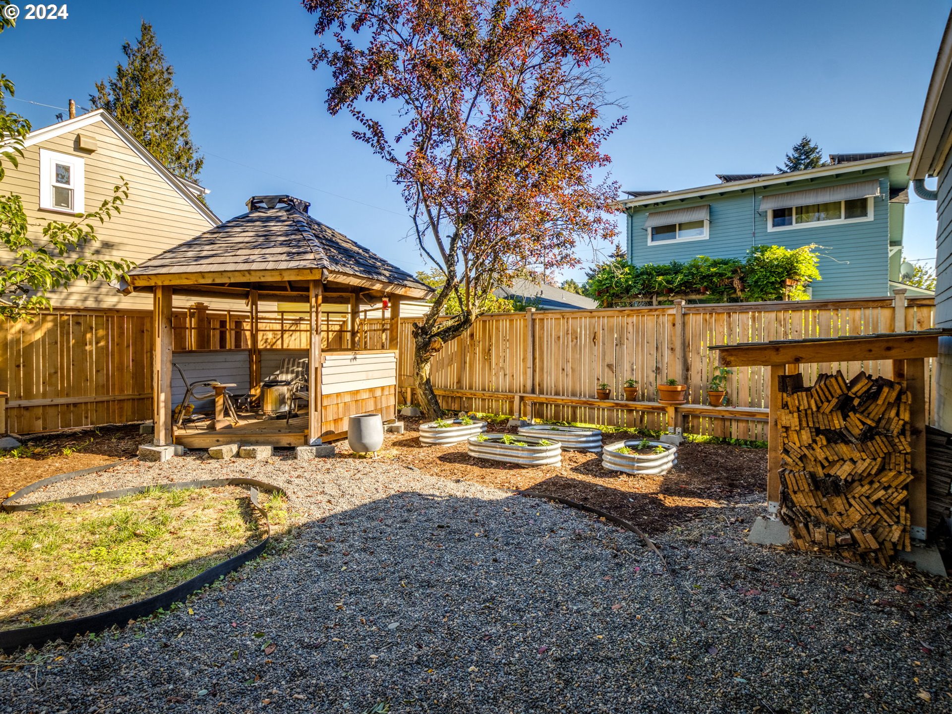 2834 Northeast 64th Avenue Portland, OR 97213 - Photo 17 of 27 a view of a house with backyard water and sitting area