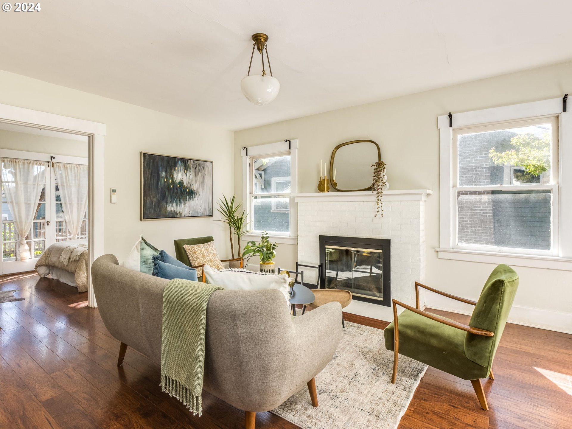2834 Northeast 64th Avenue Portland, OR 97213 - Photo 2 of 27 a living room with furniture and a fireplace