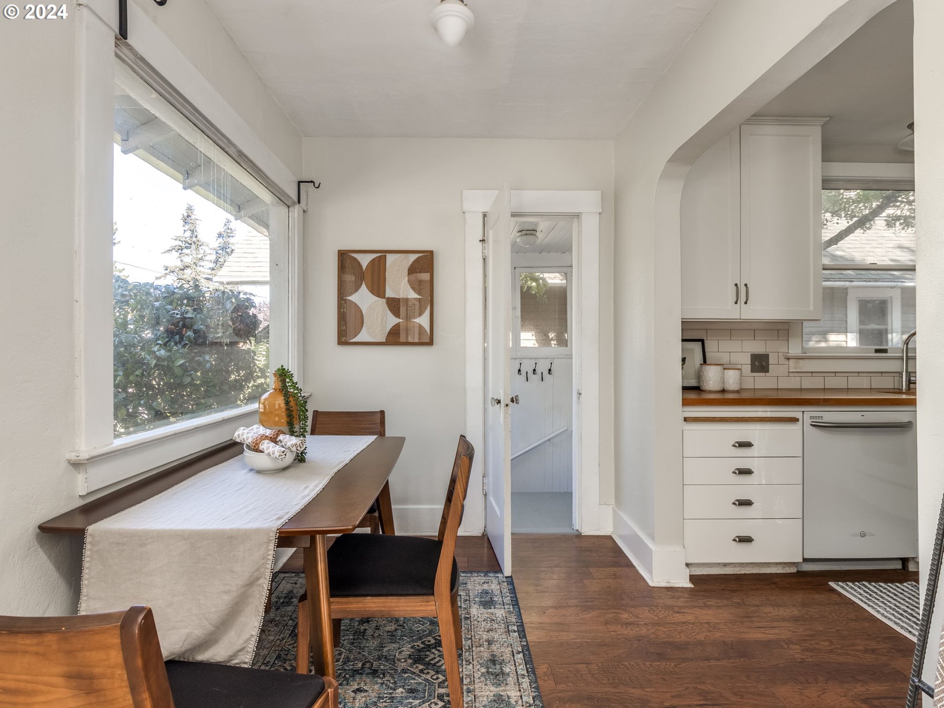 2834 Northeast 64th Avenue Portland, OR 97213 - Photo 8 of 27 a view of a dining room with furniture window and wooden floor