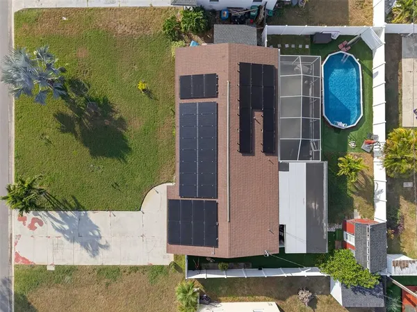 an aerial view of a house with a swimming pool