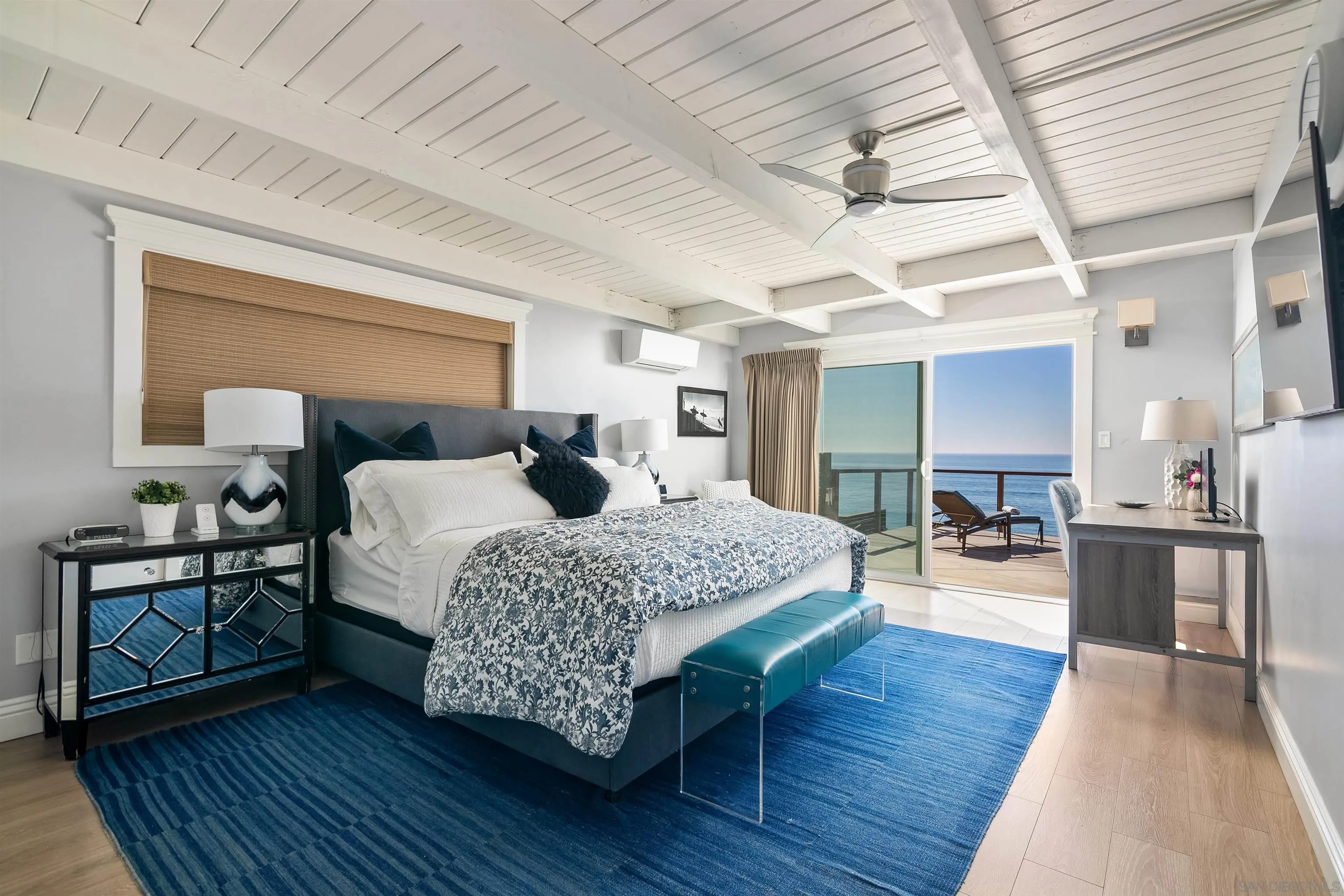 1680 Neptune Avenue Encinitas, CA 92024 - Photo 22 of 54 a bedroom with bed and wooden floor