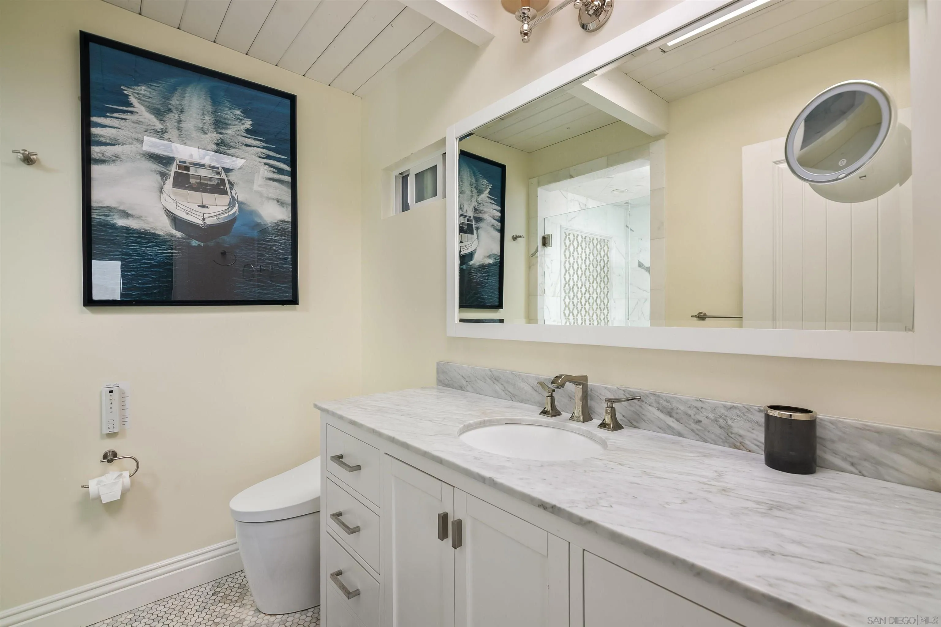 1680 Neptune Avenue Encinitas, CA 92024 - Photo 25 of 54 a bathroom with a granite countertop sink mirror and toilet