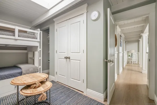 a living room with a couch and a table with wooden floor