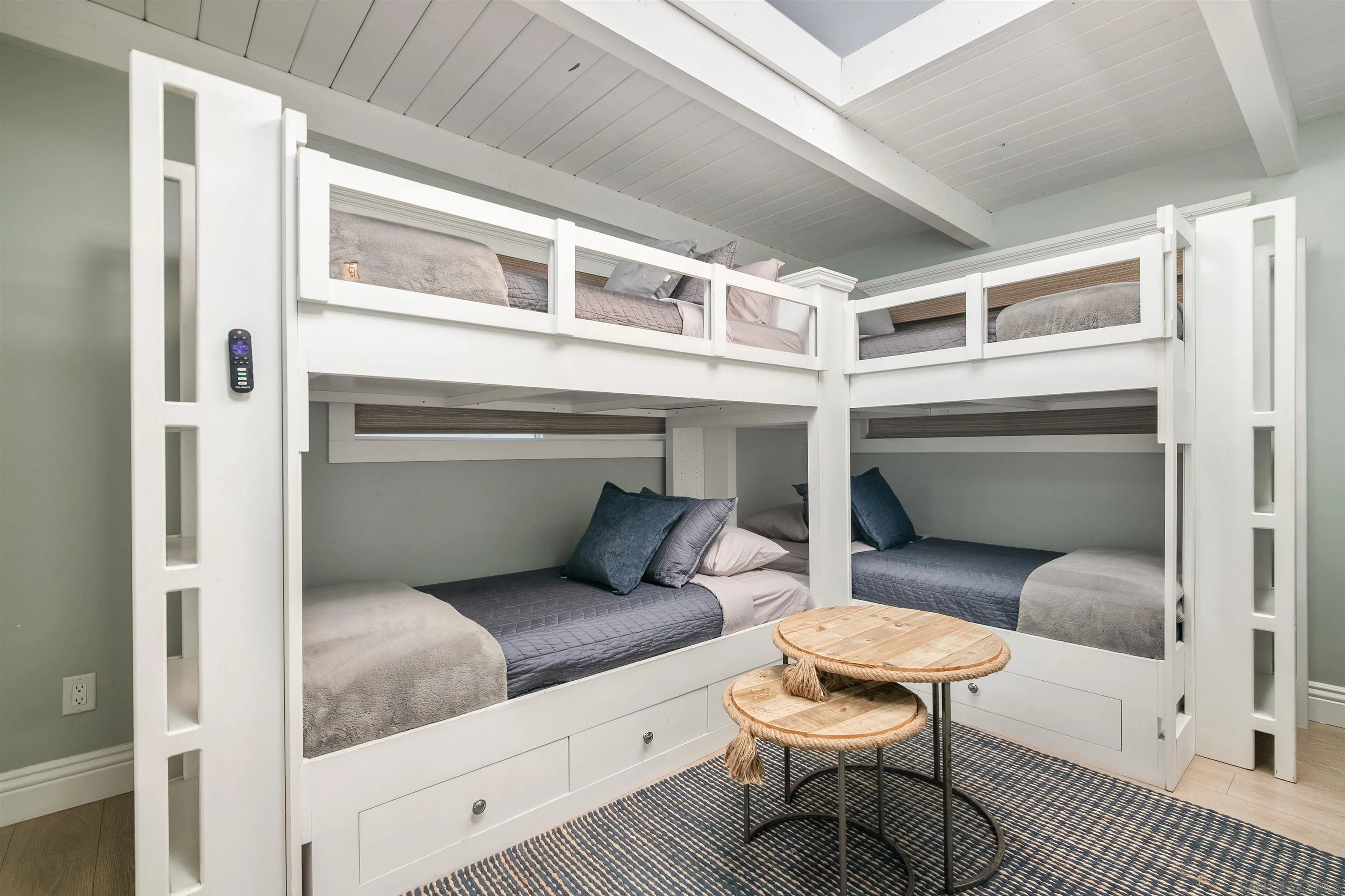 1680 Neptune Avenue Encinitas, CA 92024 - Photo 31 of 54 a living room with a couch and a table with wooden floor