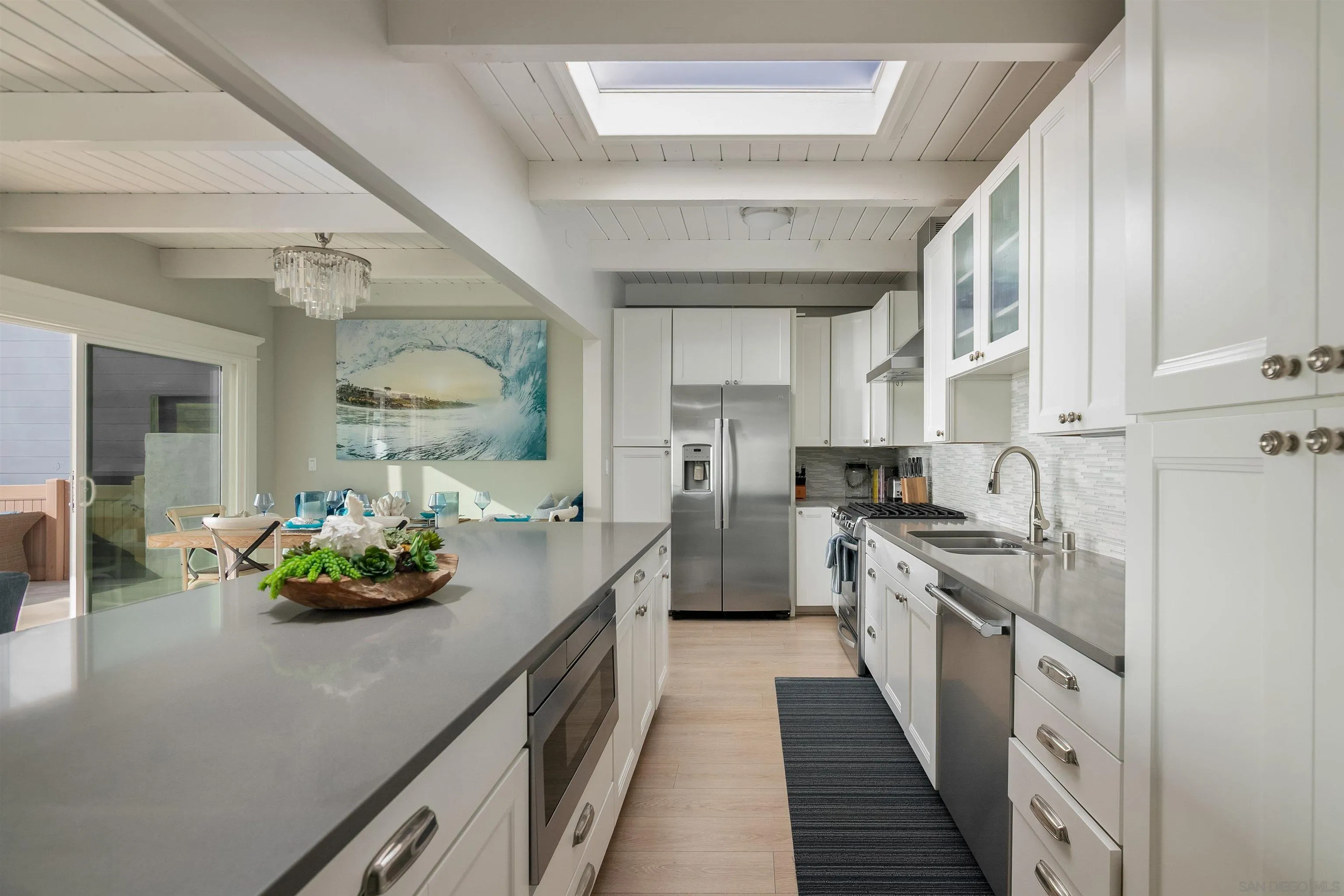 1680 Neptune Avenue Encinitas, CA 92024 - Photo 35 of 54 a kitchen with sink stove and cabinets