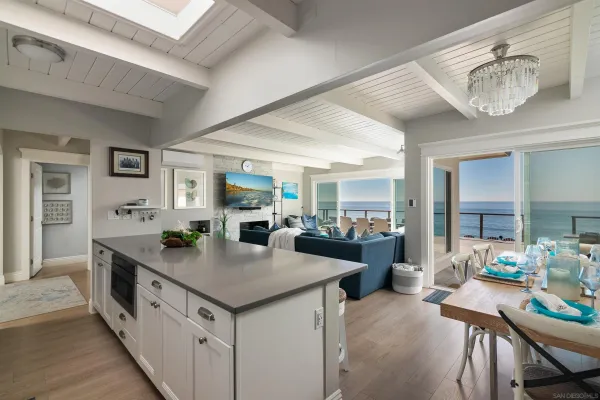 a dining room with furniture and a chandelier