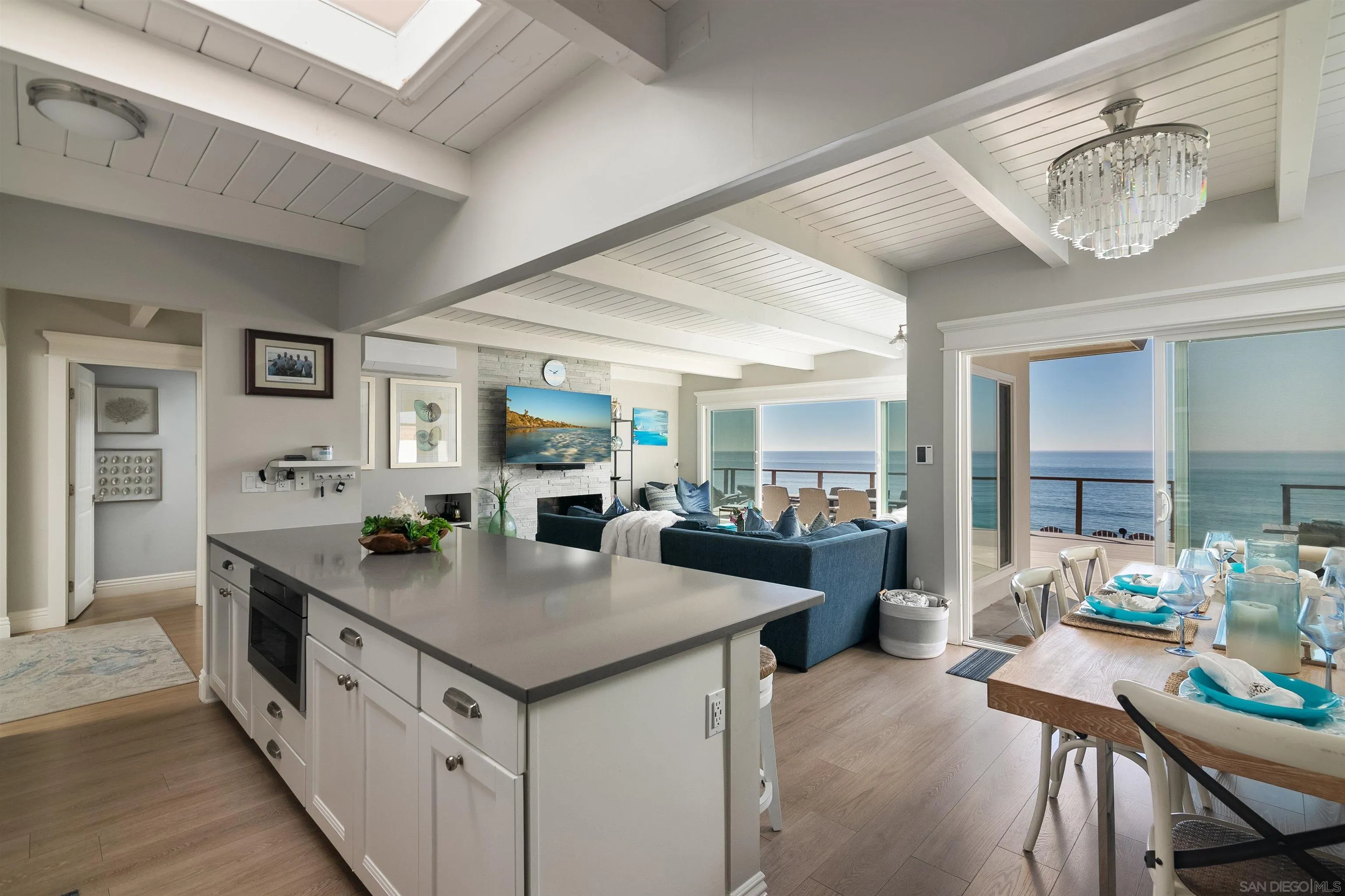 1680 Neptune Avenue Encinitas, CA 92024 - Photo 36 of 54 a view of kitchen island a sink and living room