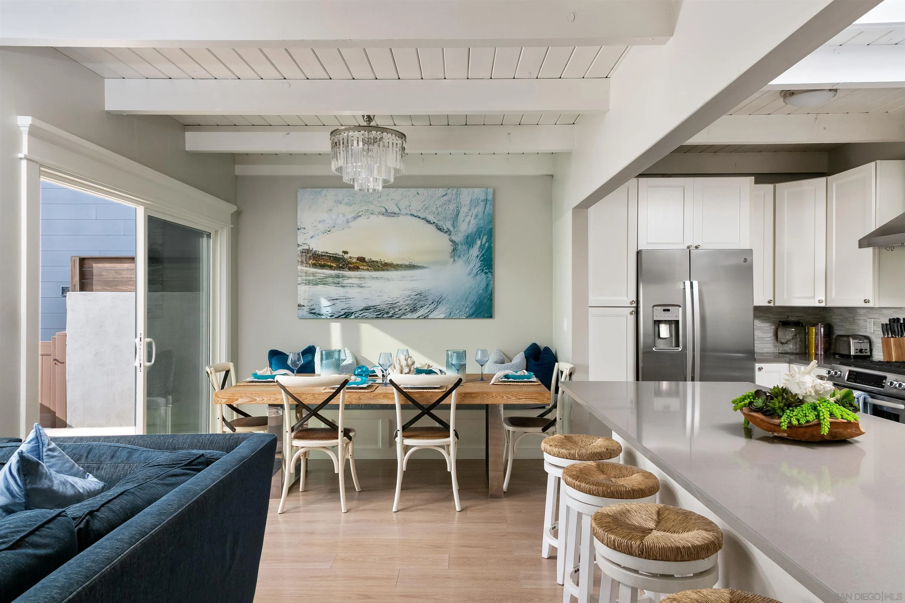 1680 Neptune Avenue Encinitas, CA 92024 - Photo 38 of 54 a dining room with furniture and a chandelier