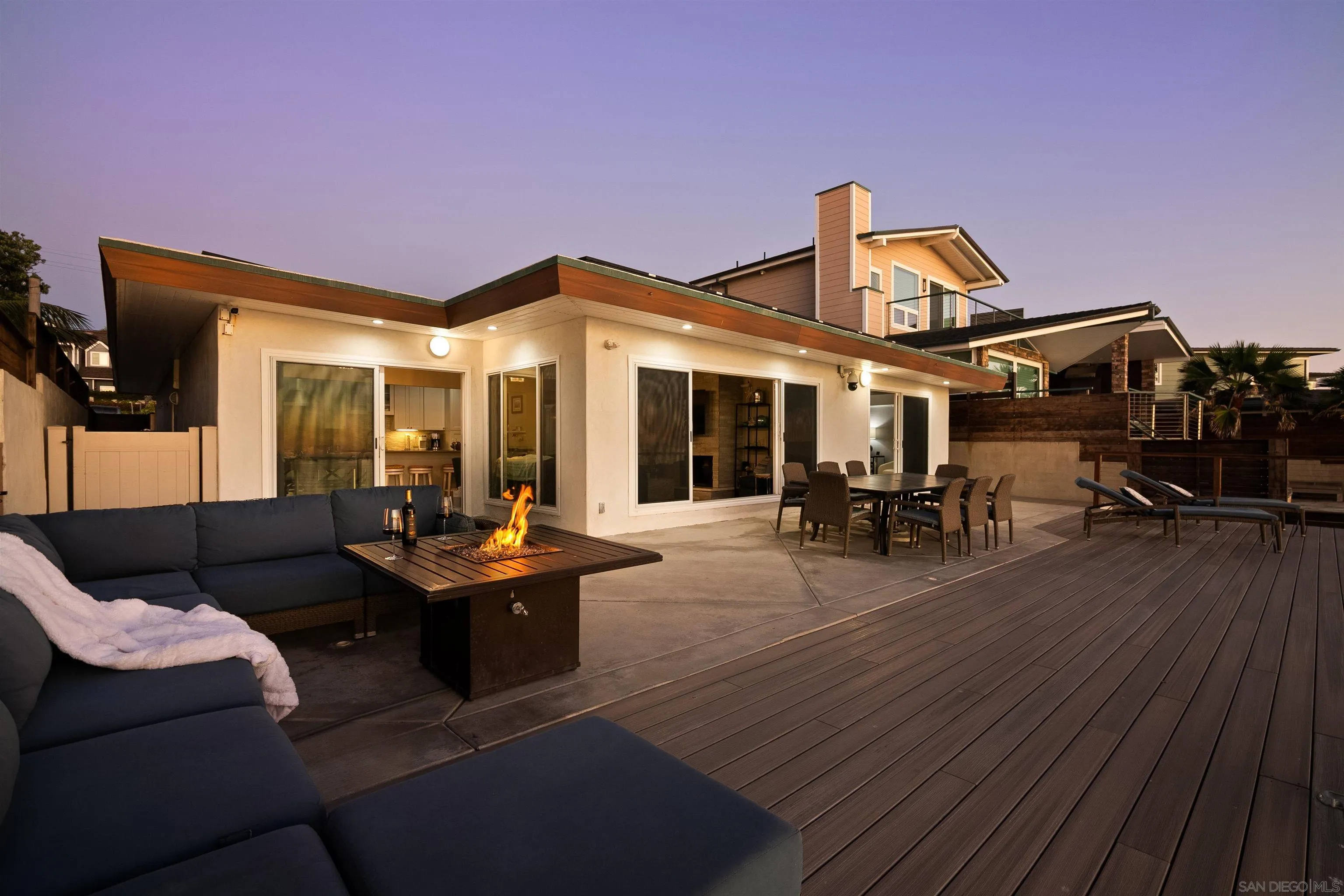 1680 Neptune Avenue Encinitas, CA 92024 - Photo 4 of 54 a view of a patio with couches table and chairs and wooden floor