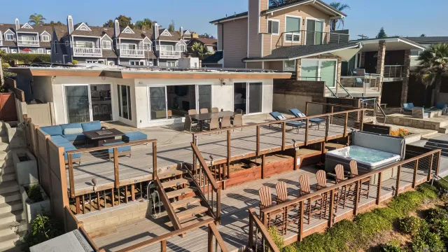 a view of a house with swimming pool and sitting area