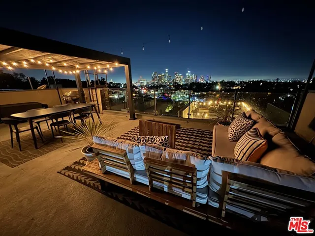 a view of a chairs and table in patio