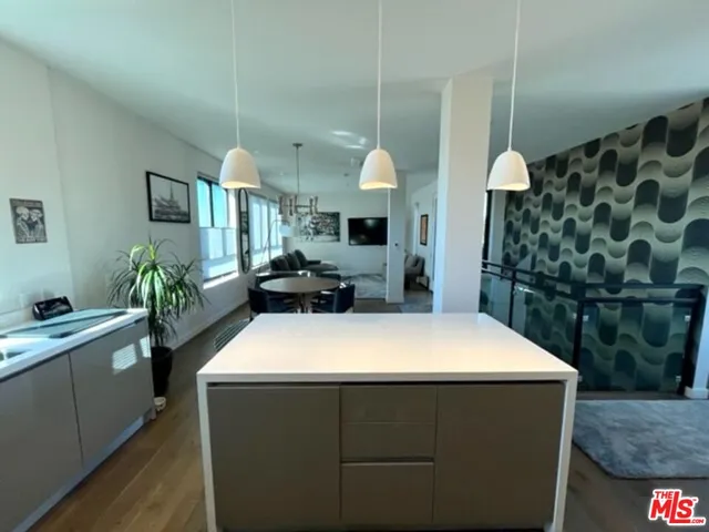 a room with sink and mirror