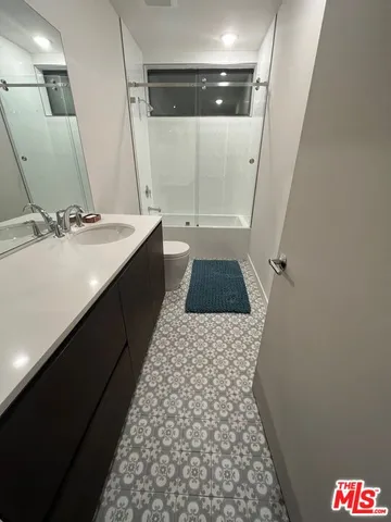 a bathroom with a sink and toilet
