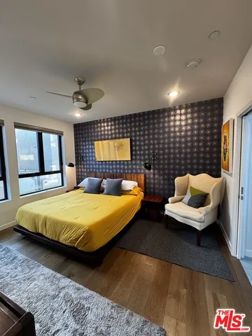 a bathroom with a sink mirror and a shower