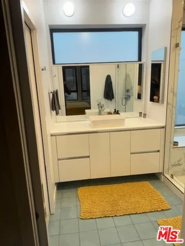 a utility room with sink dryer and washer