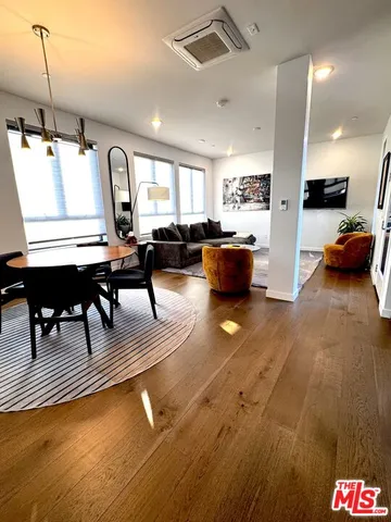 a living room with lots of furniture and a table
