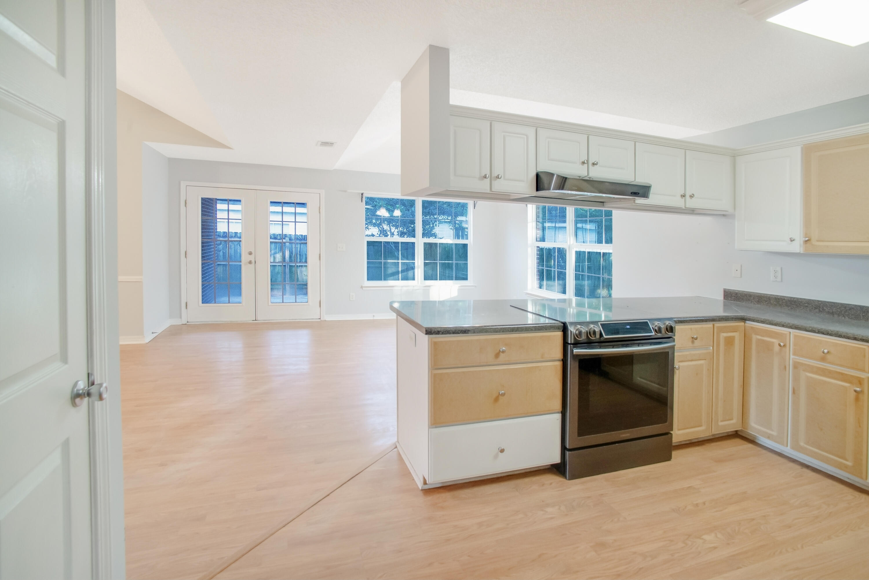 107 Kyle Lane Crestview, FL 32539 - Photo 16 of 25 a kitchen with stainless steel appliances granite countertop a stove and a sink