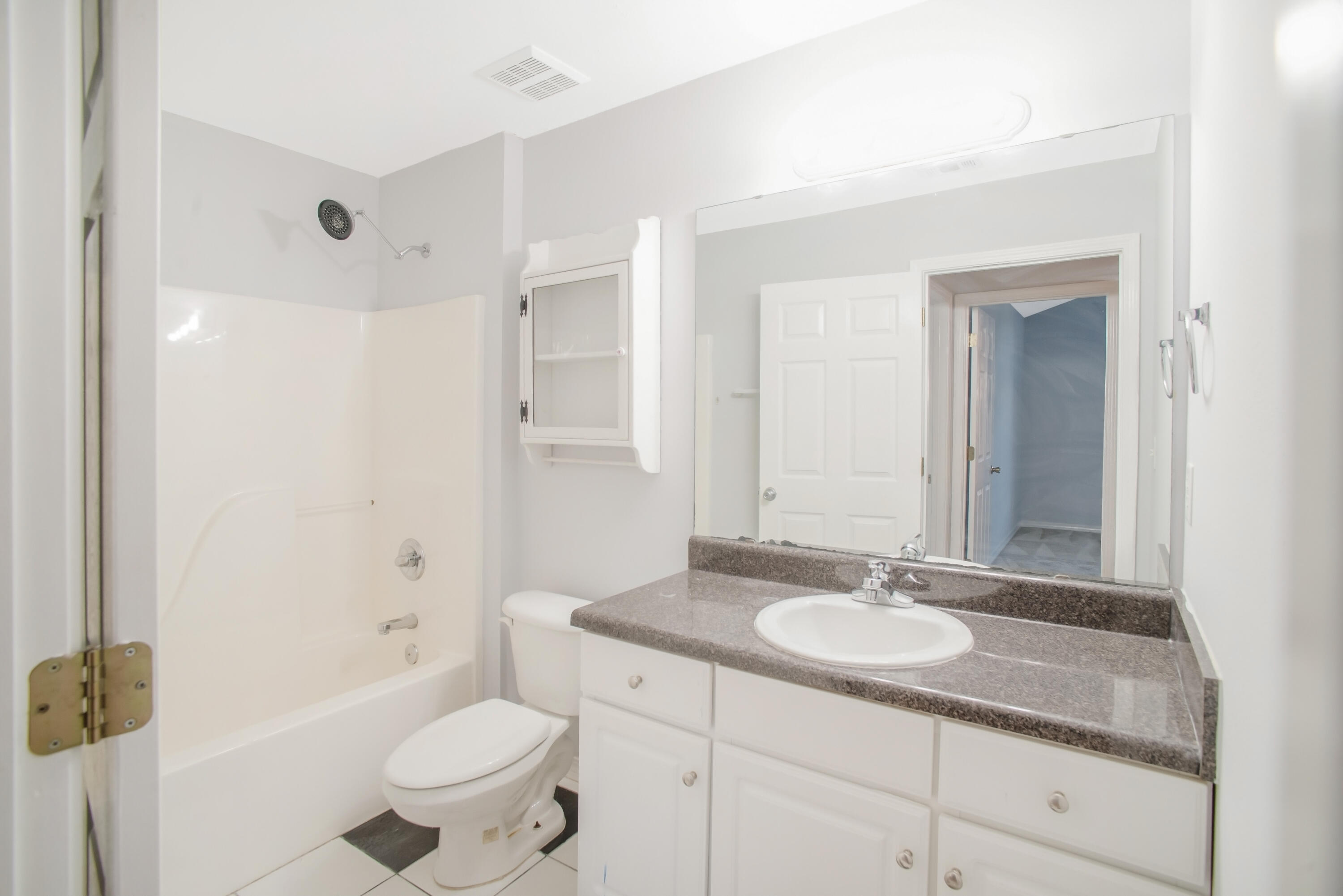 107 Kyle Lane Crestview, FL 32539 - Photo 20 of 25 a bathroom with a sink toilet a mirror and shower