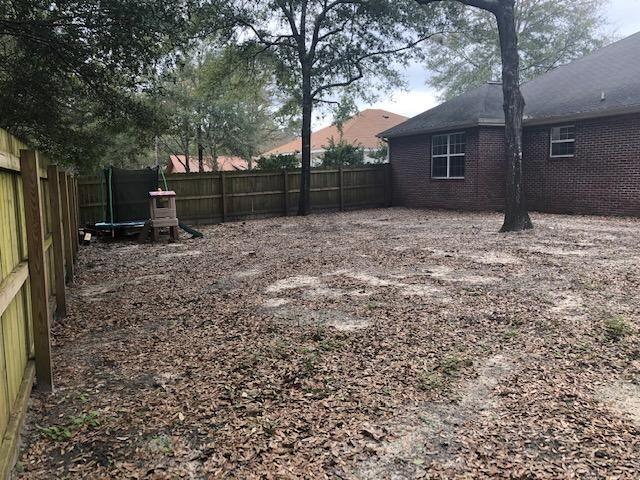 107 Kyle Lane Crestview, FL 32539 - Photo 25 of 25 a backyard of a house with lots of green space