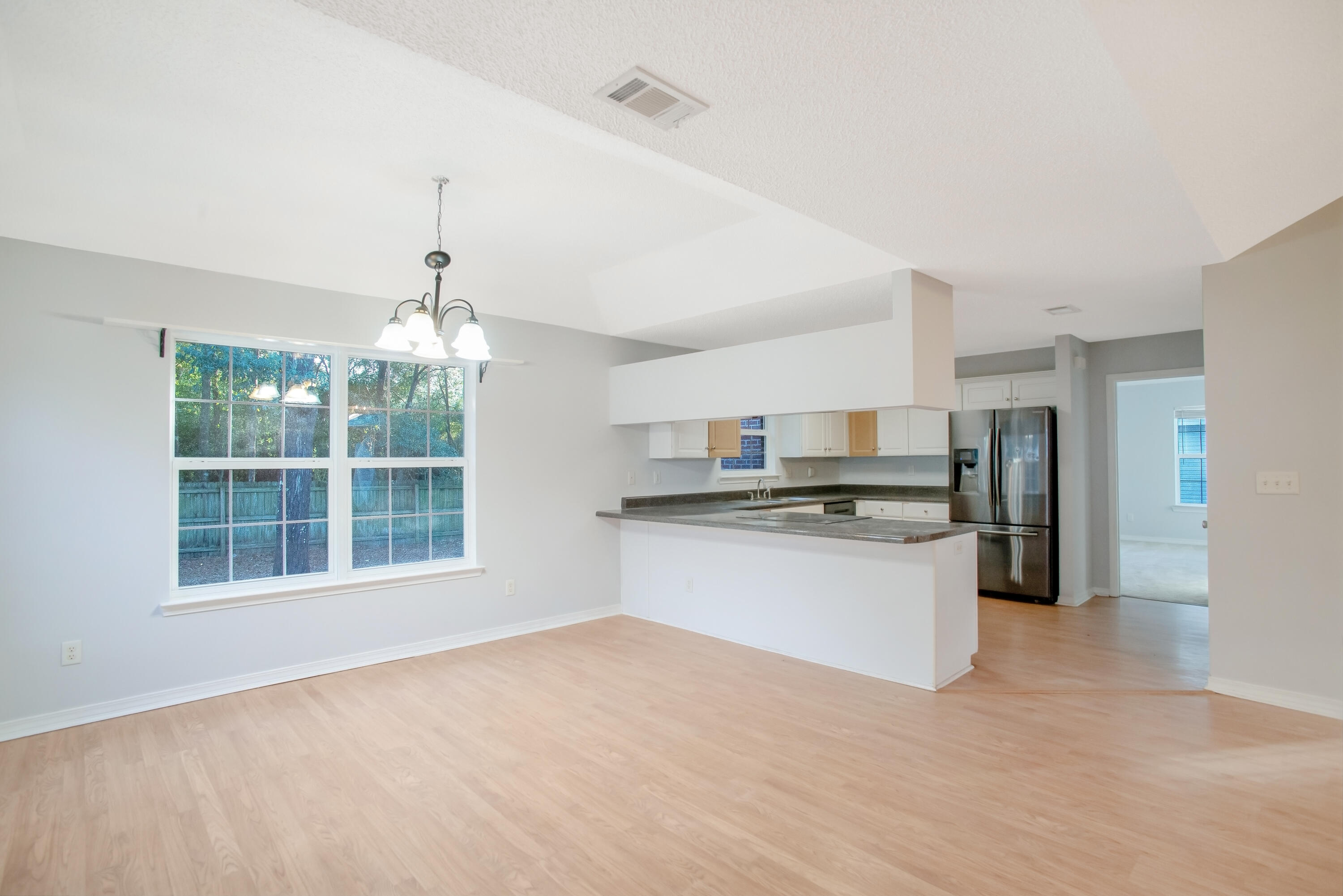 107 Kyle Lane Crestview, FL 32539 - Photo 4 of 25 a kitchen with stainless steel appliances granite countertop a refrigerator and a sink