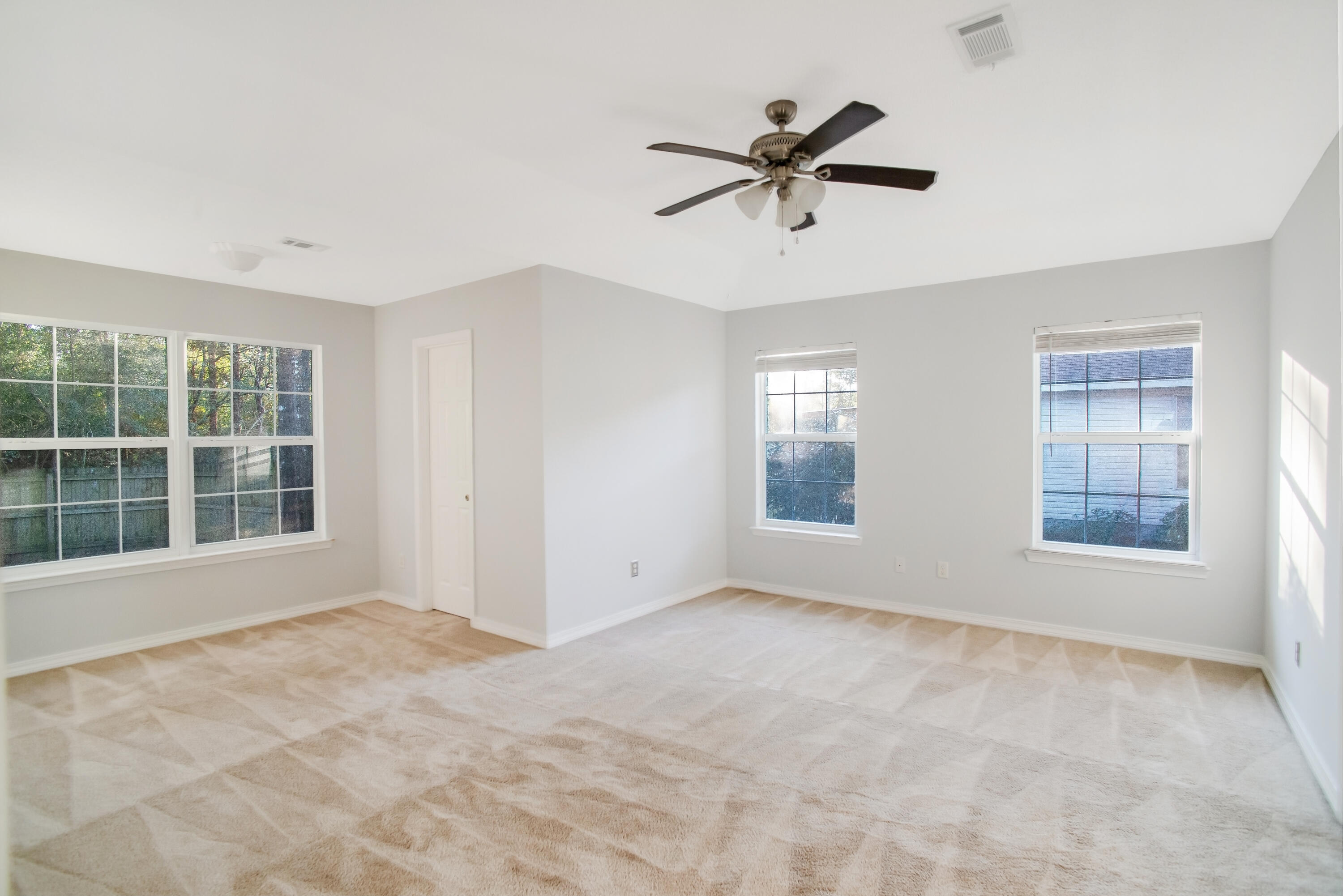 107 Kyle Lane Crestview, FL 32539 - Photo 7 of 25 a view of an empty room with a window