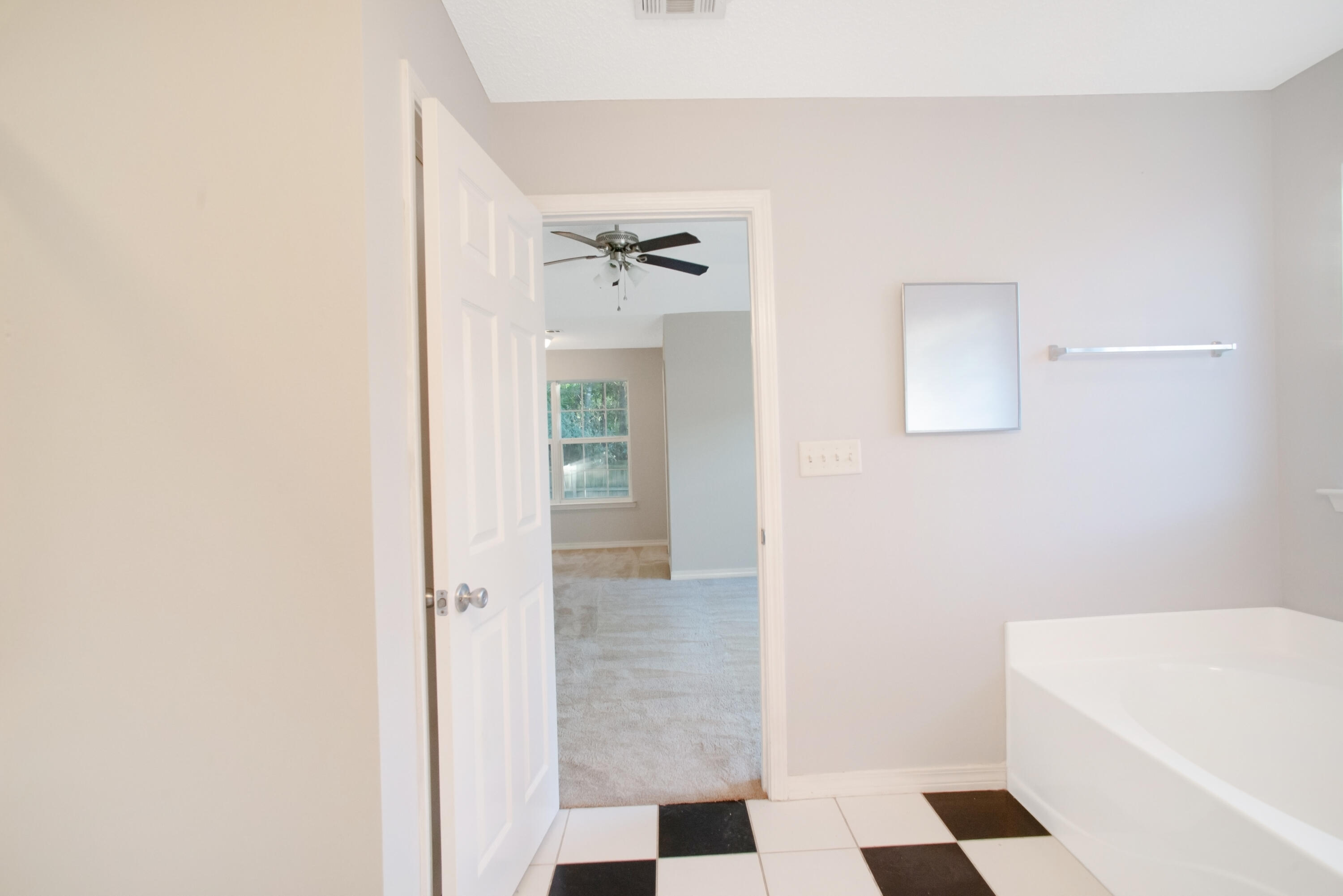 107 Kyle Lane Crestview, FL 32539 - Photo 10 of 25 a bathroom with a bathtub and a shower