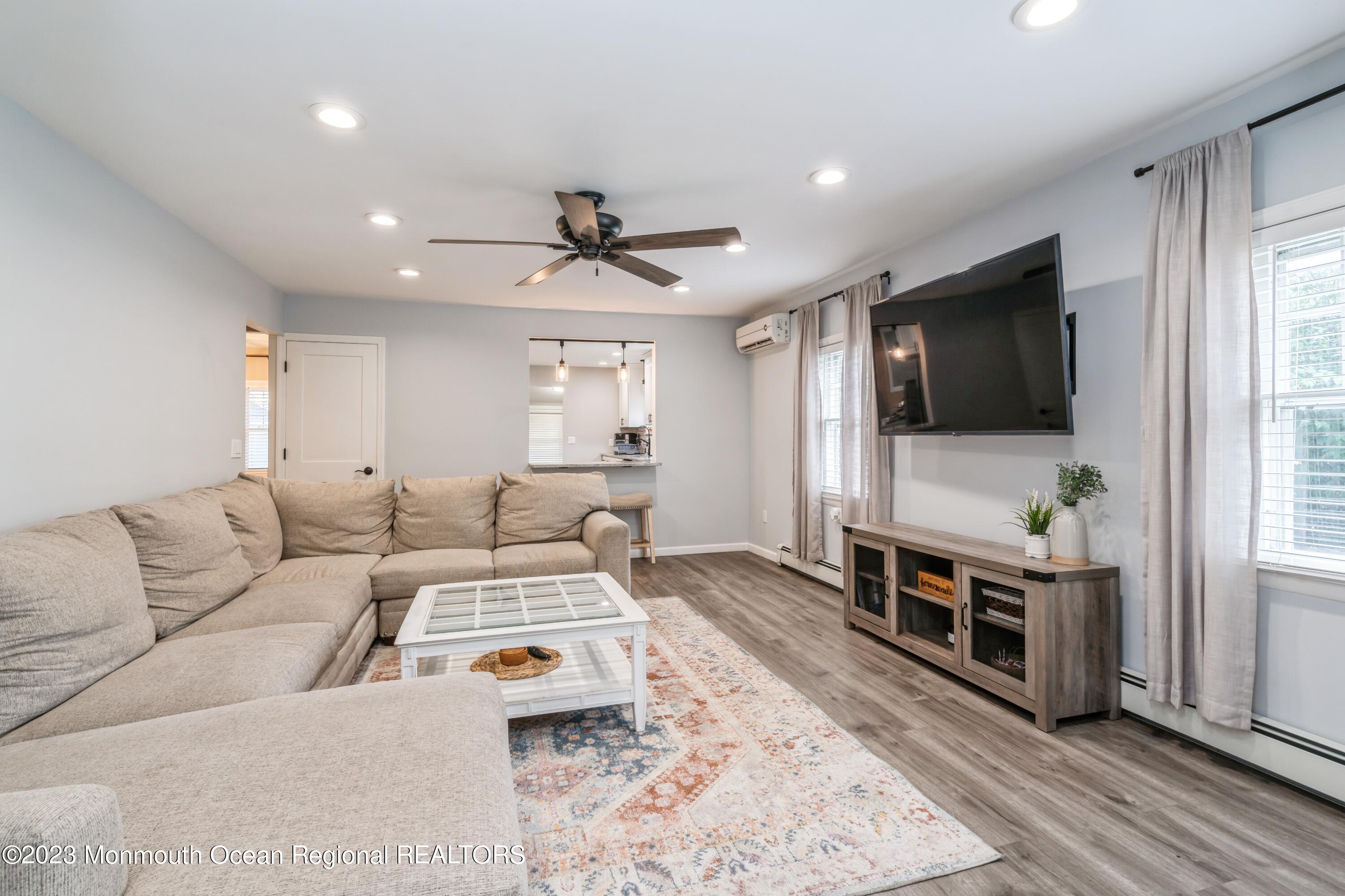 167 Cedarhurst Road Brick, NJ 08723 - Photo 5 of 21 a living room with furniture and a flat screen tv